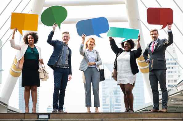 five person standing while holding templates
